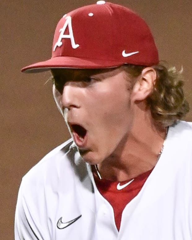 Razorbacks' Hagen Smith celebrates closing out 5-2 win over Tennessee to start series.